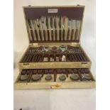 A collection of cased cutlery.