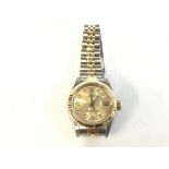 Ladies Rolex Datejust. Champagne face with diamond