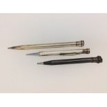 Three silver propelling pencils, postage cat A