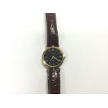 A round dial Gucci watch, some damage. Shipping ca