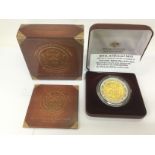 A cased 2007 gold plated silver proof coin from th