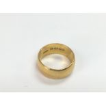 A 22ct gold wedding band, approx 11.3g and approx