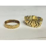 Two unmarked rings. postage cat a