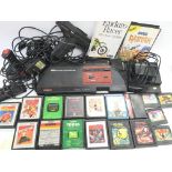 A Sega Master System with accessories and various