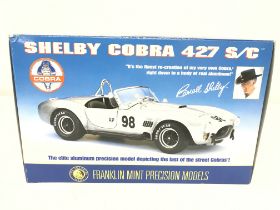 A Boxed Franklin Mint Shelby Cobra 427 S/C. With p