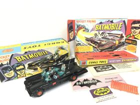 A Boxed Corgi Batmobile #267. All complete with ro