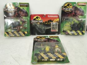 Collection of four carded Jurassic Park action fig