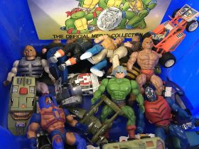 An assorted collection of toy and action figures i