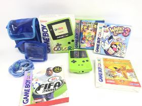 A Boxed Nintendo Game Boy Color. (Green) with 4 Bo