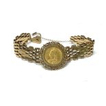 A gold gate bracelet set with an 1892 sovereign. A