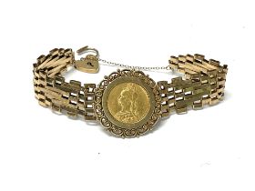 A gold gate bracelet set with an 1892 sovereign. A