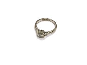An 18ct white gold 66pts diamond solitaire ring. A