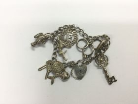 A sterling silver charm bracelet. Shipping categor