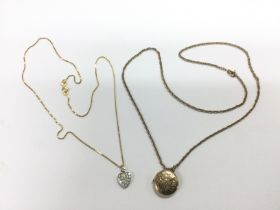Two gold chains with pendants, one 9ct and one 14k
