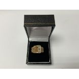 A 9ct gold white stone set buckle ring. (A) 9.2g.