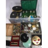 A box of interesting items including compacts, lig