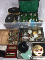 A box of interesting items including compacts, lig