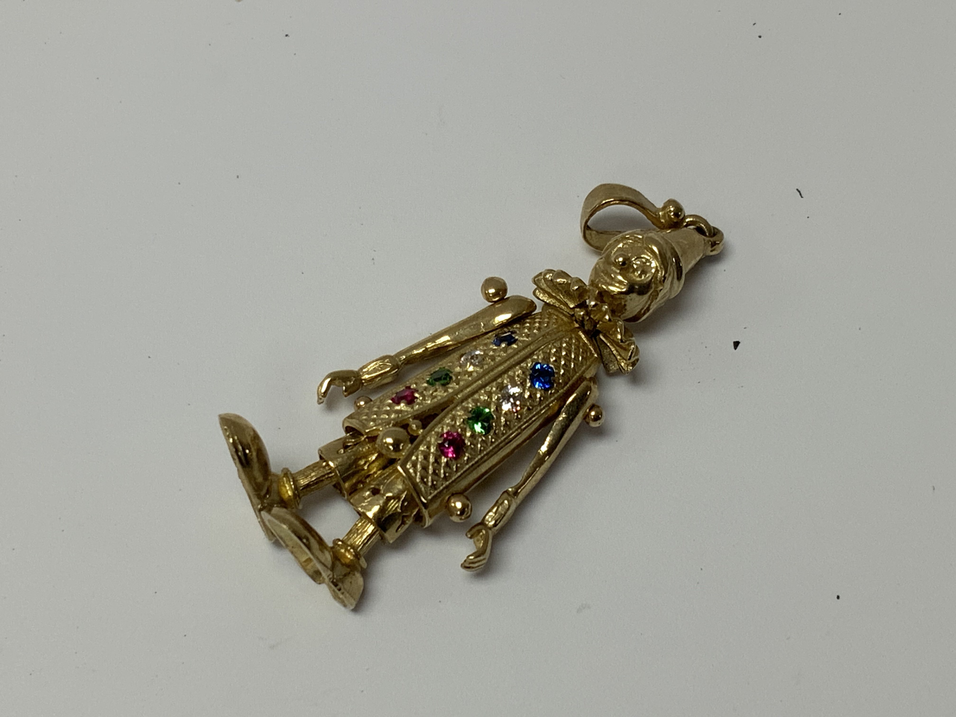 A 9ct gold stone set clown pendant, 8.3g (A)