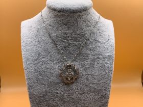 A 9ct gold and dimaond set pendant and chain. (A)