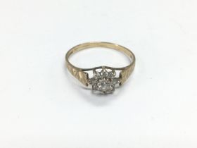 A 9ct gold ring set with a central CZ stone with s
