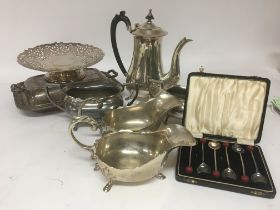 A collection of silver plate coffee pot dishes cas