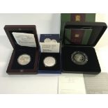 Three silver coins including a proof Swiss Army kn