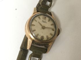 A ladies vintage MuDu 18carat gold watch with a me