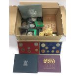 A box of coins to include Royal Mint proof sets. S