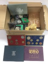 A box of coins to include Royal Mint proof sets. S