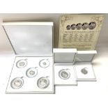 A cased Silver Sovereign 5 coin set together with
