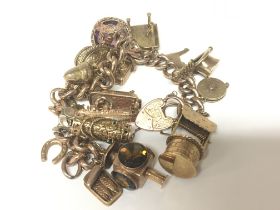 A 9carat gold charm bracelet weight 77g