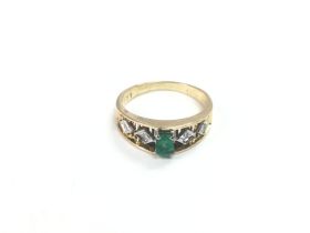 A 14k gold, emerald and diamond ring, approx 0.04c