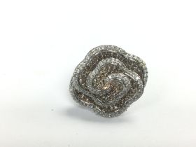 A large 9ct white and rose gold swirling floral diamond ring, approx 9.2g and approx size M-N.