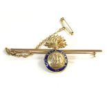 A 9ct gold Northumberland fusiliers bar broach. 5.