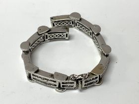A heavy white gold watch bracelet inset with bague