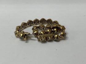 A heavy 9ct gold and diamond set line bracelet eac