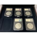 5 slabbed Morgan silver dollars to include. 1921 D