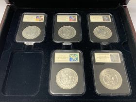 5 slabbed Morgan silver dollars to include. 1921 D