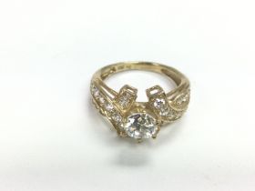 An unusual mounted stone set ring stamped both 375
