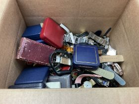 A large box of mixed watches and medallions.