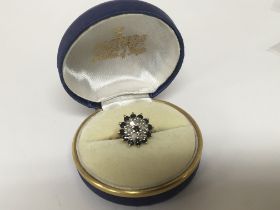 A gold ring set with a cluster pattern of sapphire