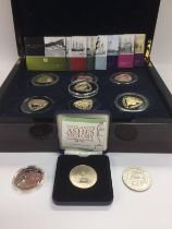 A cased collection of Royal Mint coins plus three