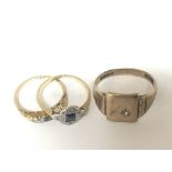 Two 18 carat gold rings set with sapphire and smal