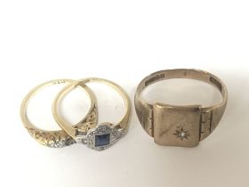 Two 18 carat gold rings set with sapphire and smal