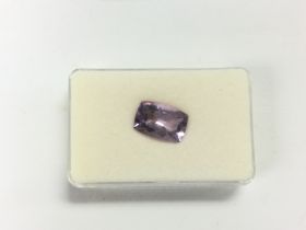 A certificated cushion shaped amethyst, amethyst approx 6.52ct. Certificate number WGI9642146747.