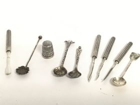 A collection of silver salt spoons, manicure set a