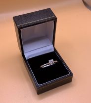 An 18ct white gold solitare diamond ring, approxim