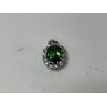 18ct white gold tourmaline and diamond pendant. Ap