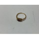 A 14ct gold ruby and diamond set ring. Approx 2.79