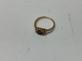 A 14ct gold ruby and diamond set ring. Approx 2.79